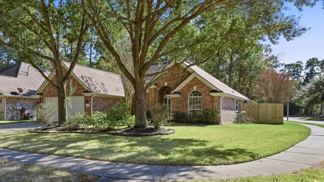 a front view of house with yard and green space
