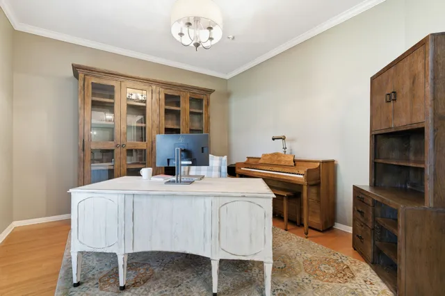a bedroom with furniture and flat screen tv