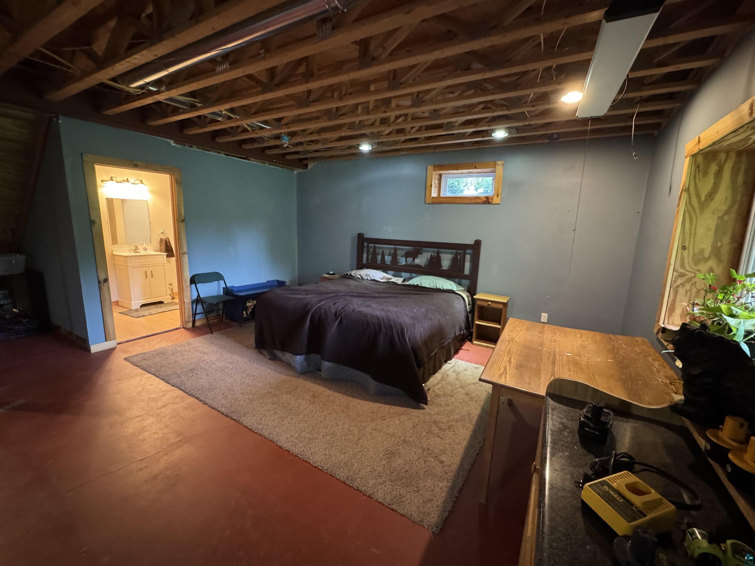 1745 Becks Road Maple, WI 54854 - Photo 30 of 46 Spacious room featuring exposed ceiling joists and recessed lighting