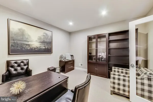 a large kitchen with a table and chairs