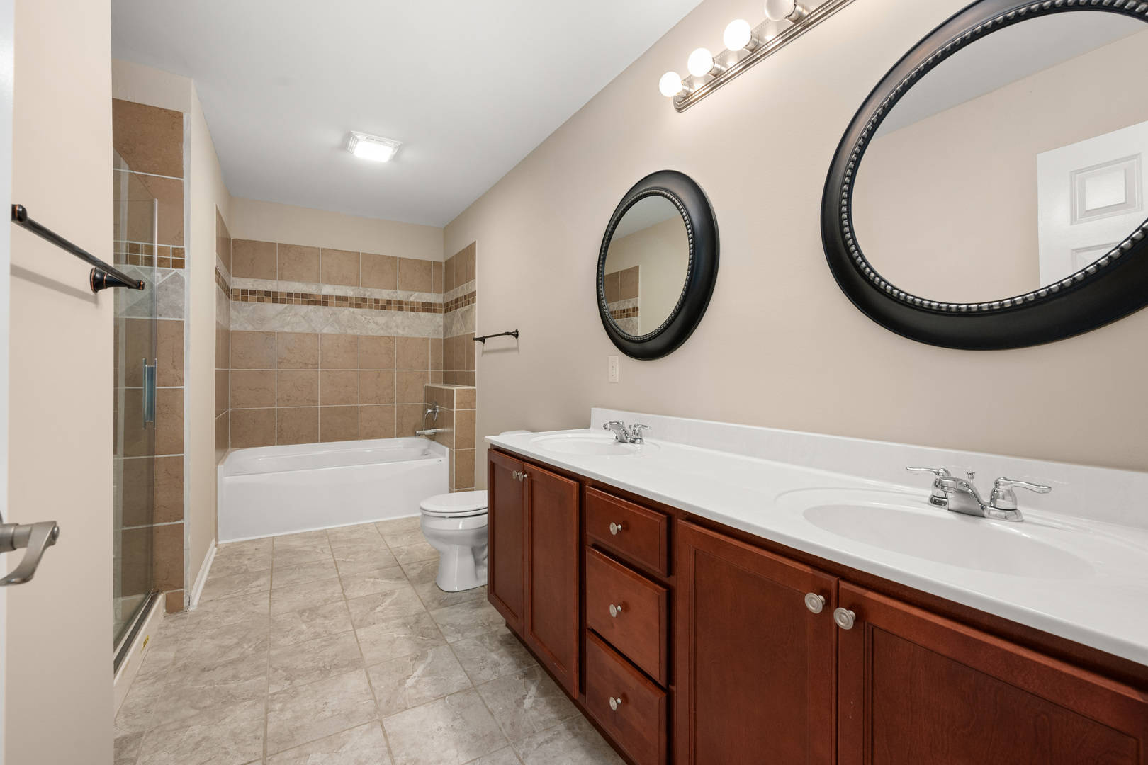 3705 Green Tree Lane DeKalb, IL 60115 - Photo 19 of 31 a bathroom with a sink and a mirror