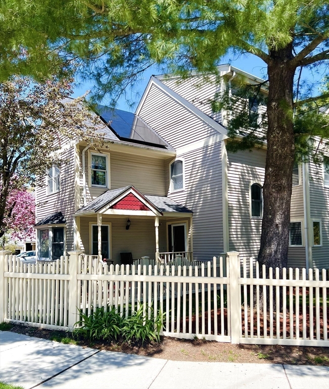 5 Rebecca Road Newton, MA 02465 - Photo 1 of 42 a front view of a house with a garden