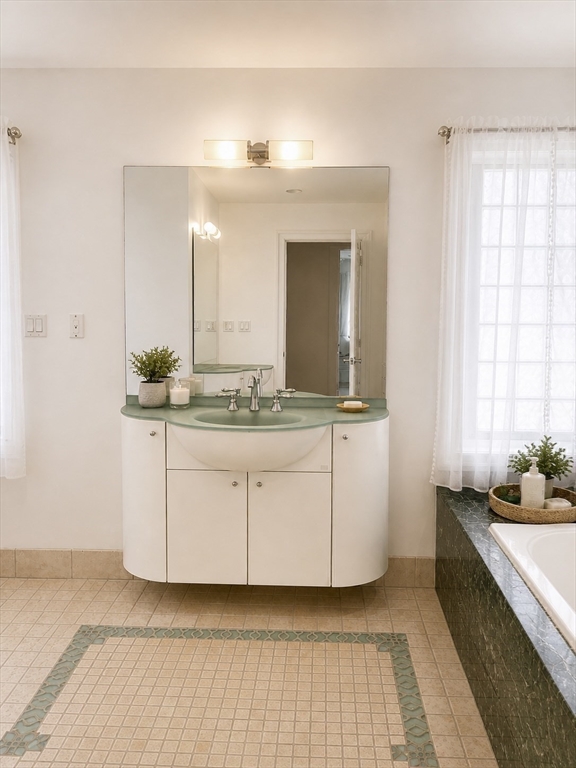 5 Rebecca Road Newton, MA 02465 - Photo 24 of 42 a bathroom with a sink and a mirror