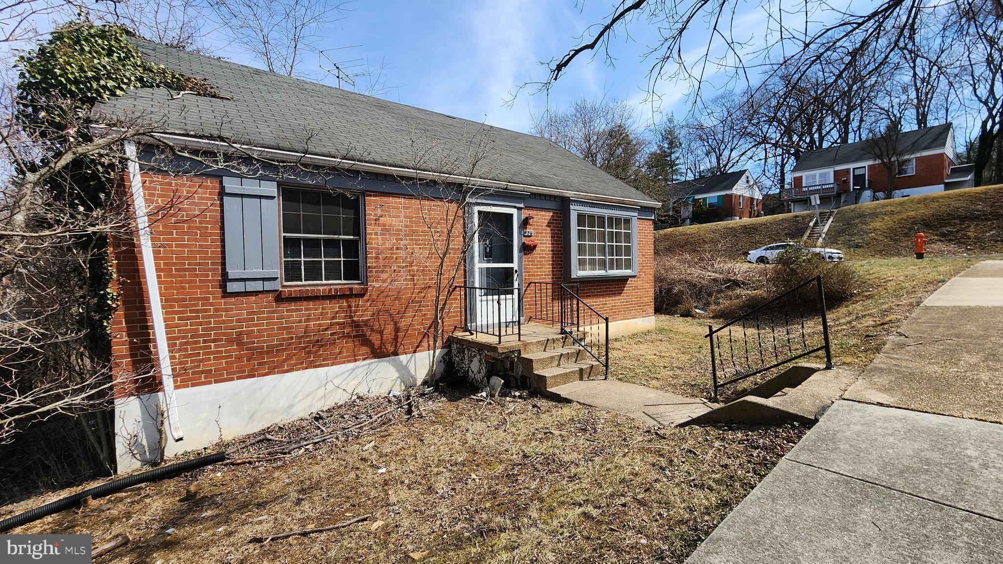 936 Olmstead Road Baltimore, MD 21208 - Photo 2 of 24 a front view of a house with a yard