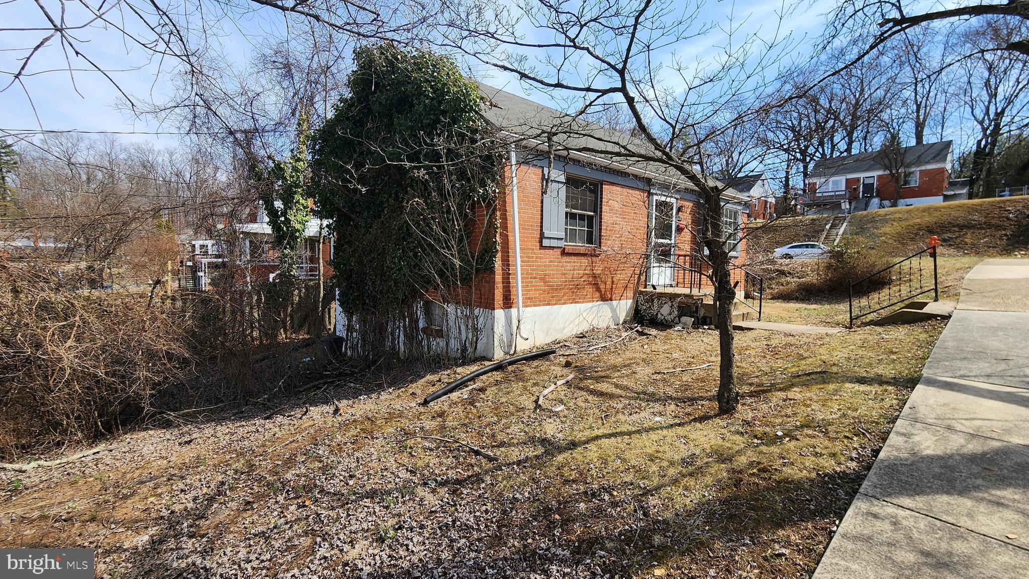 936 Olmstead Road Baltimore, MD 21208 - Photo 3 of 24 a front view of a house with trees
