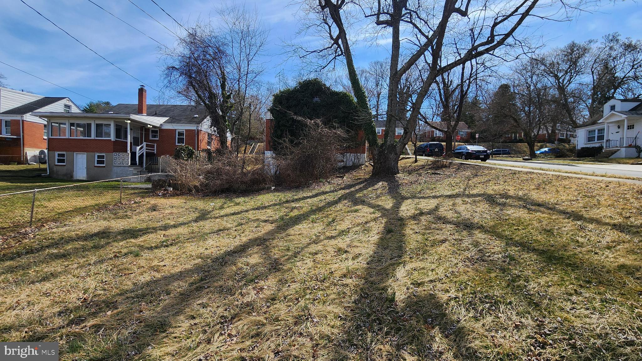 936 Olmstead Road Baltimore, MD 21208 - Photo 6 of 24 a view of a yard with snow on the road
