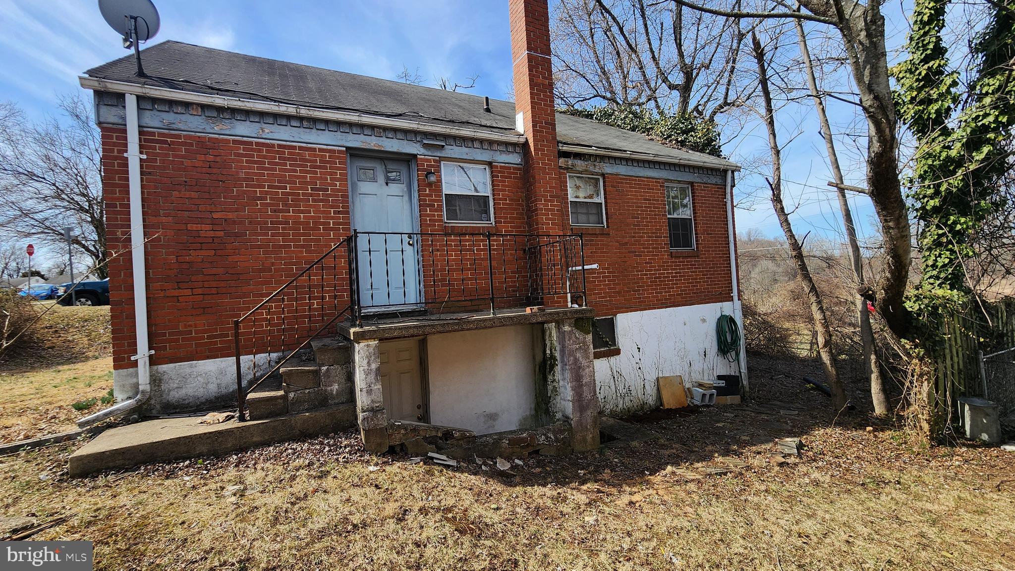 936 Olmstead Road Baltimore, MD 21208 - Photo 7 of 24 a front view of a house with a yard