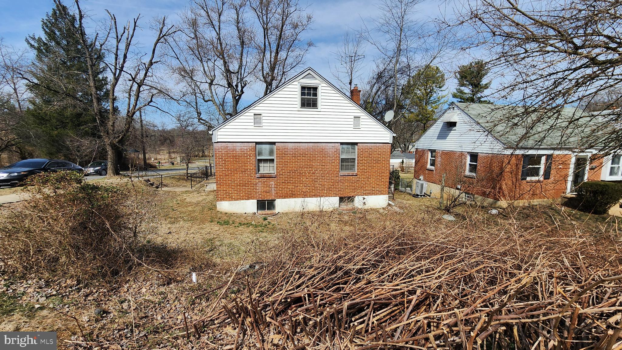 936 Olmstead Road Baltimore, MD 21208 - Photo 8 of 24 a front view of a house with a yard