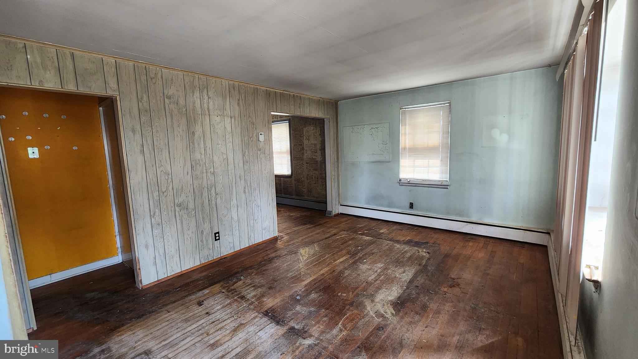 936 Olmstead Road Baltimore, MD 21208 - Photo 9 of 24 an empty room with windows and closet