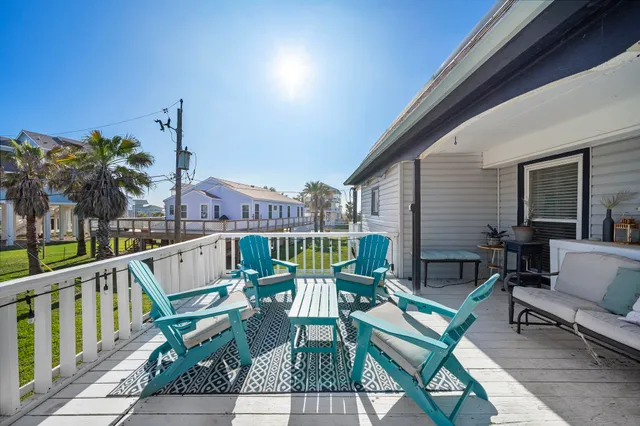 a view of two chairs in the balcony