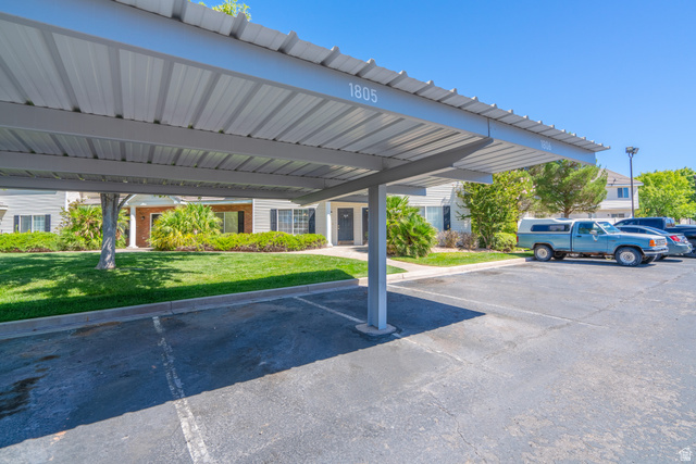 1735 West 540 North, Unit 1805 St. George, UT 84770 - Photo 62 of 64 Carport parking structure with a corrugated metal roof and painted number detailing