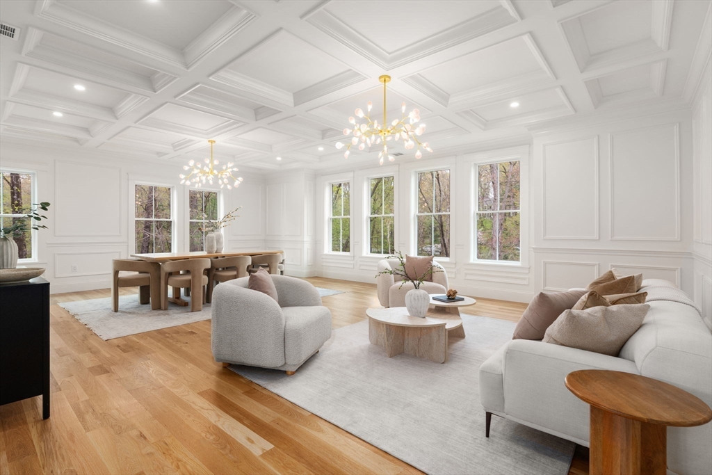 82 Deer Path Lane Weston, MA 02493 - Photo 11 of 42 a living room with furniture and a chandelier