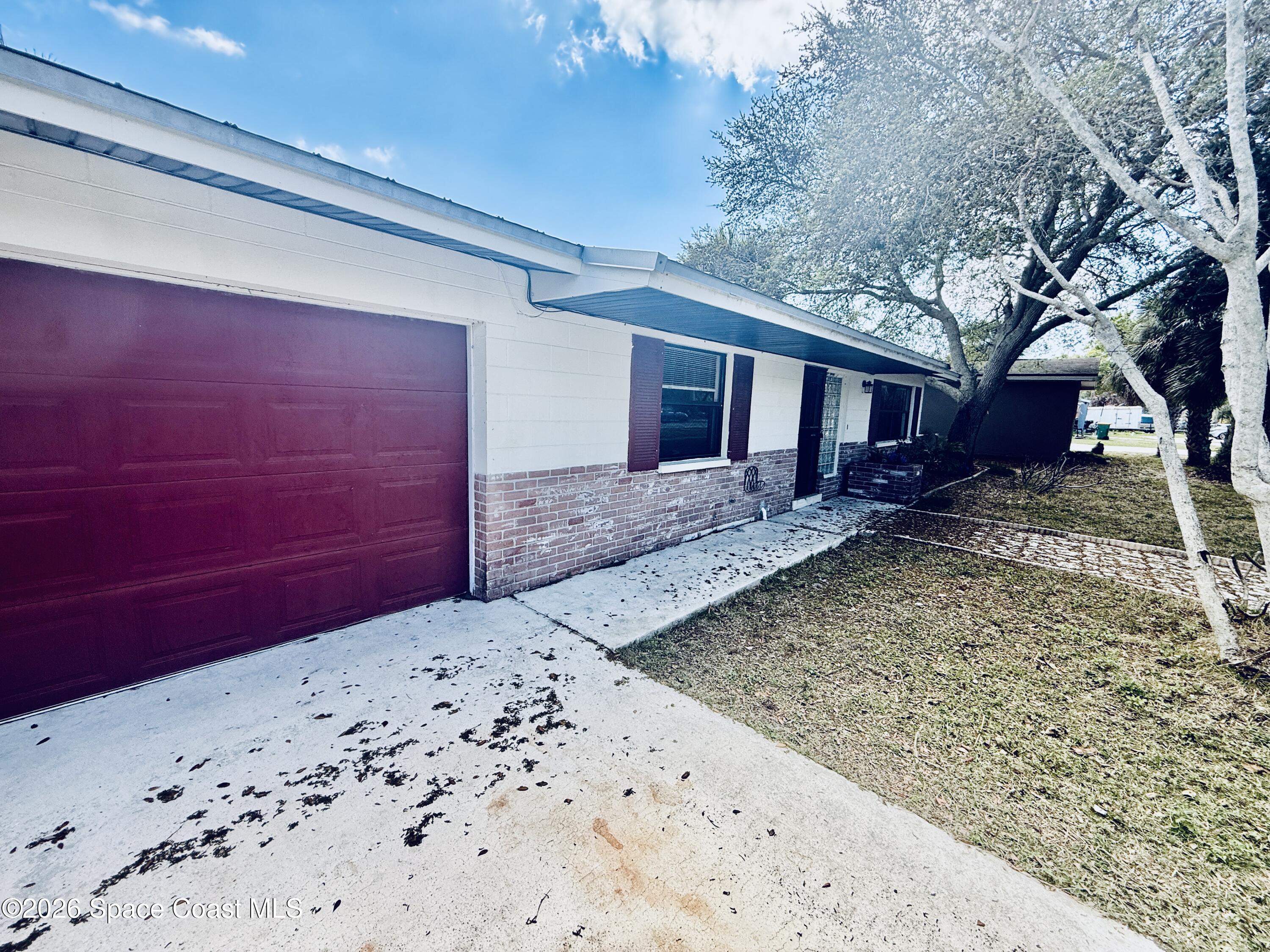 410 South Tropical Trail Merritt Island, FL 32952 - Photo 2 of 28 20260309_161119285_iOS