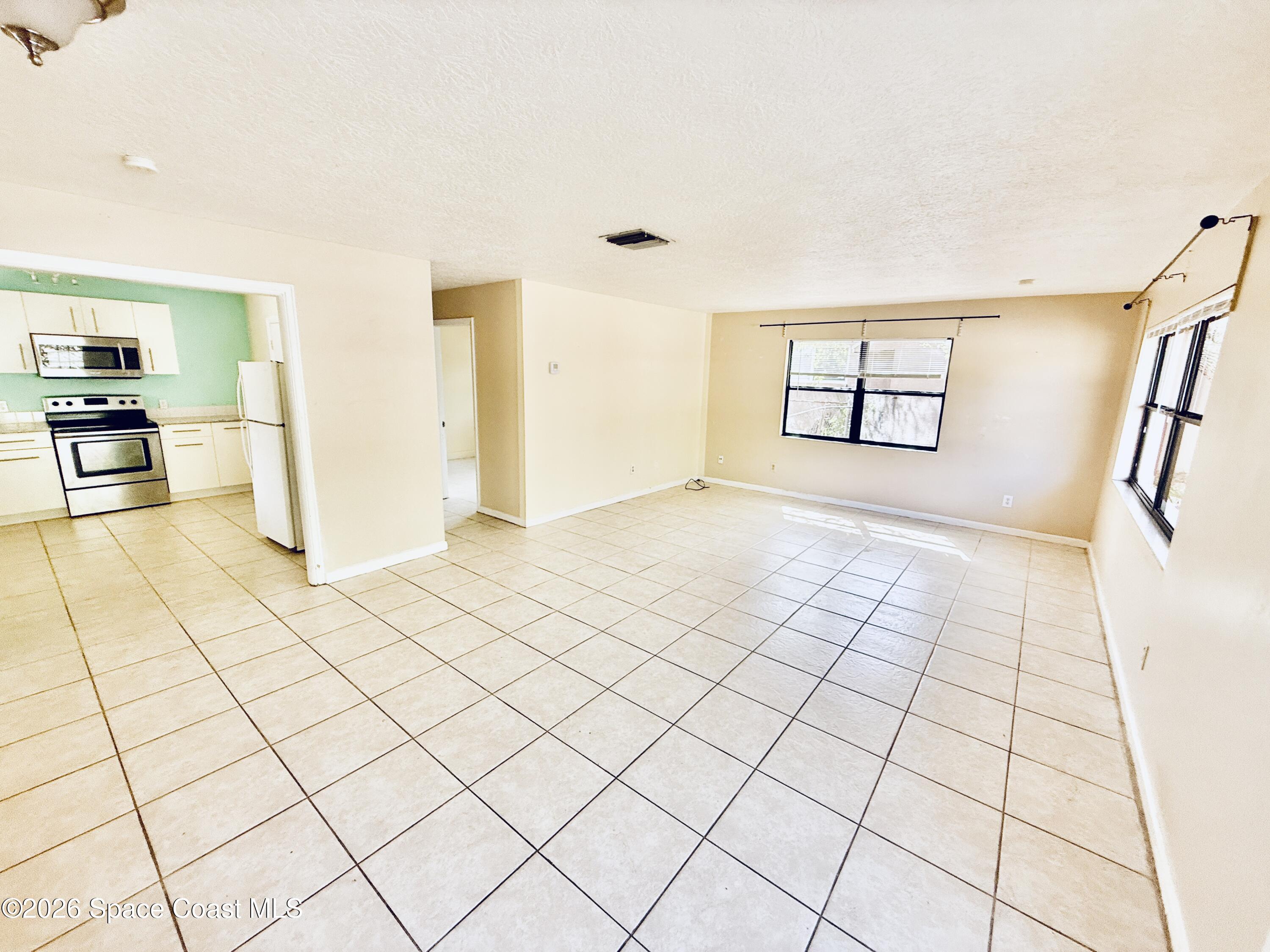 410 South Tropical Trail Merritt Island, FL 32952 - Photo 8 of 28 20260309_161331322_iOS
