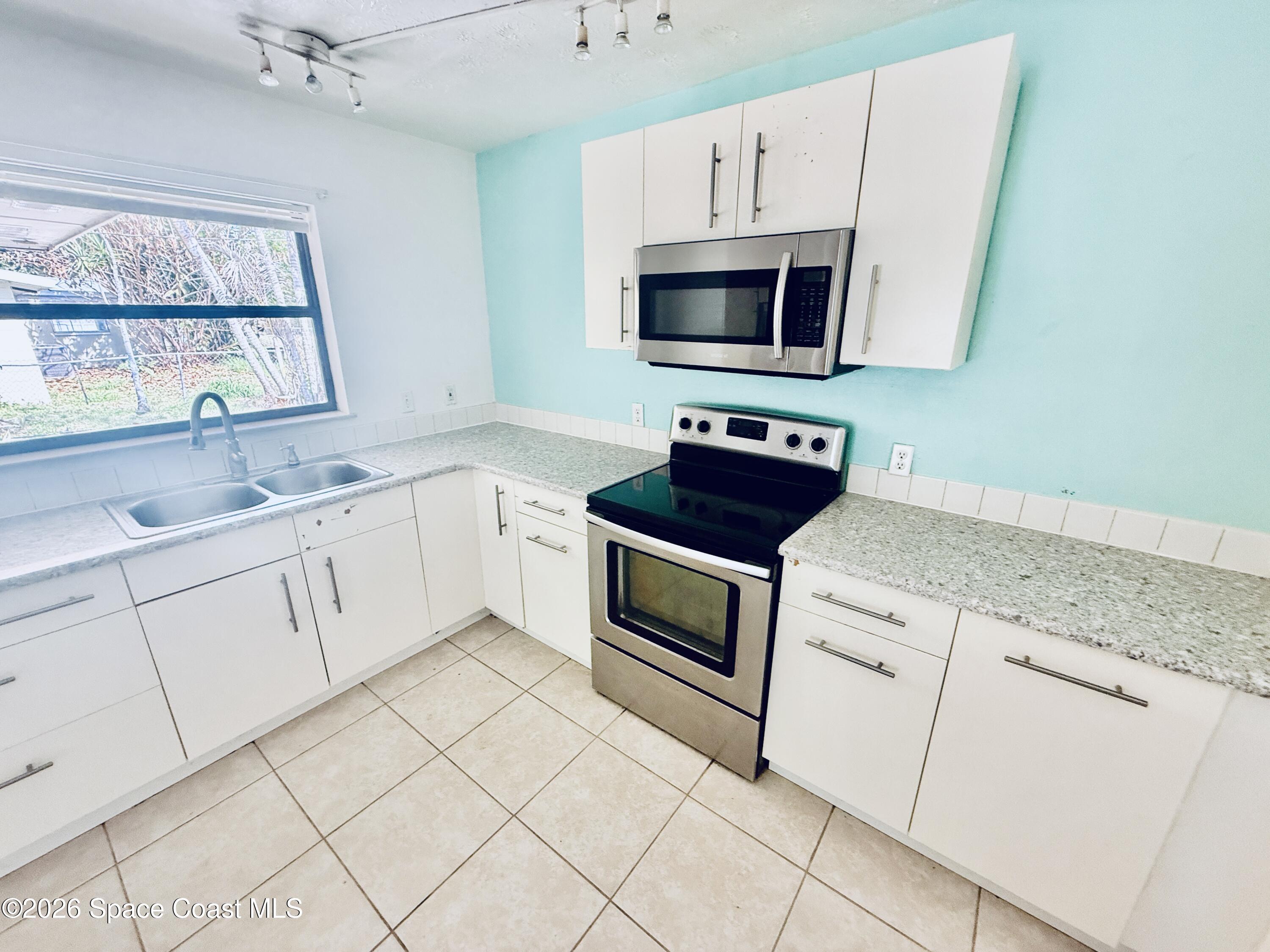 410 South Tropical Trail Merritt Island, FL 32952 - Photo 10 of 28 20260309_161404760_iOS