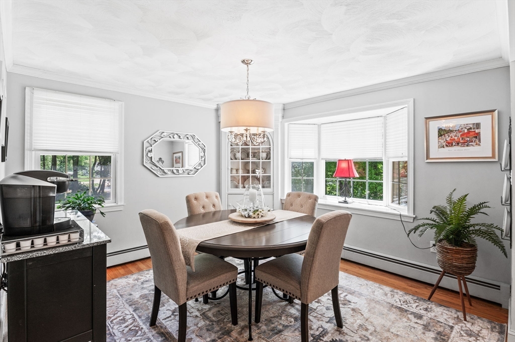 9 Sagamore Road Ipswich, MA 01938 - Photo 17 of 42 a dining room with furniture a rug and a chandelier