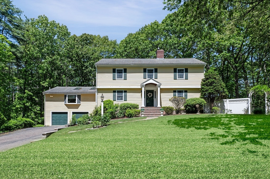 9 Sagamore Road Ipswich, MA 01938 - Photo 2 of 42 a front view of a house with a yard and trees