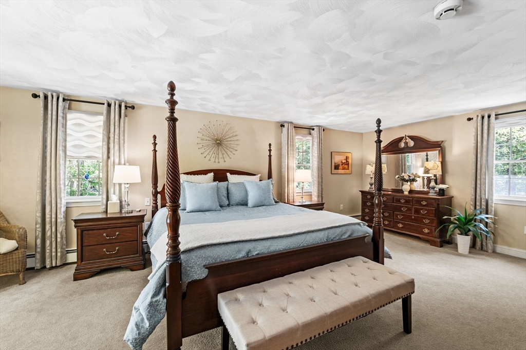 9 Sagamore Road Ipswich, MA 01938 - Photo 21 of 42 a bedroom with a bed a table and chair