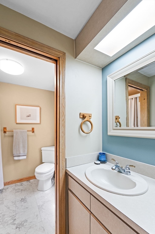 9 Sagamore Road Ipswich, MA 01938 - Photo 32 of 42 a bathroom with a sink a mirror and toilet