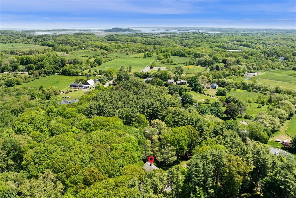 9 Sagamore Road Ipswich, MA 01938 - Photo 4 of 42 a view of a green field with lots of bushes