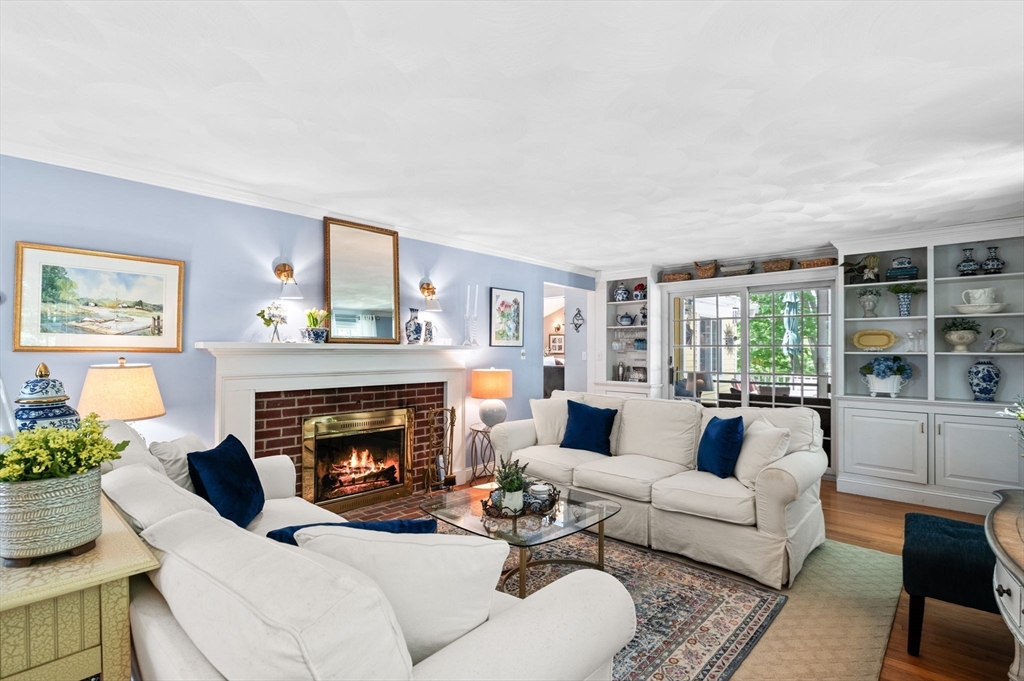 9 Sagamore Road Ipswich, MA 01938 - Photo 7 of 42 a living room with furniture a window and a fireplace