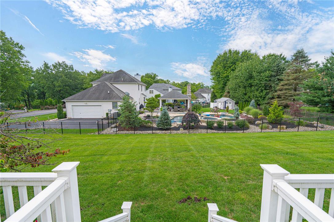 102 Sutton Road Easton, PA 18045 - Photo 70 of 83 Manicured green lawns stretch toward an inviting swimming pool and backyard patio retreat.