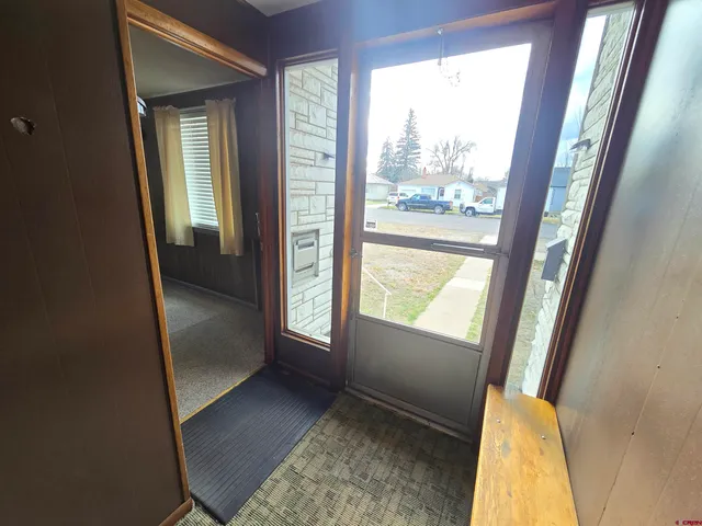 a view of an empty room with a fireplace