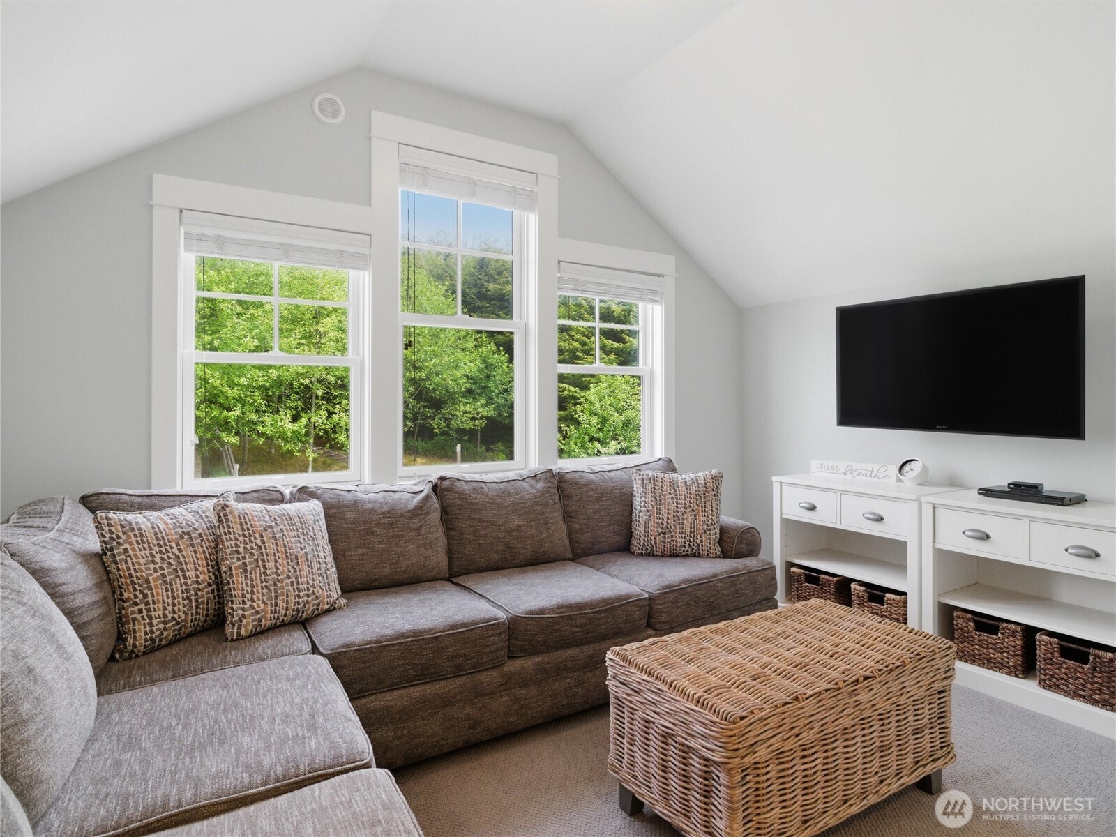 269 Compass Street Pacific Beach, WA 98571 - Photo 18 of 38 a living room with furniture and a flat screen tv