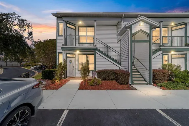 a view of a car park in front of a house