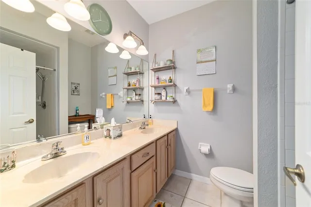 a bedroom with two beds and a window