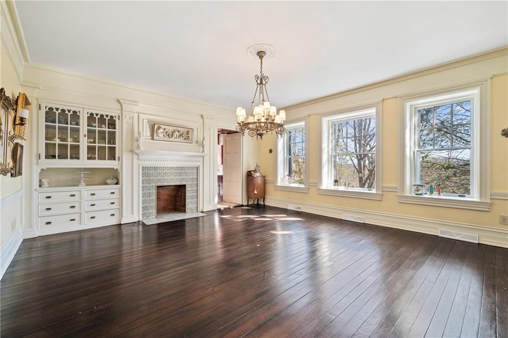 9 Little Sewickley Creek Road Sewickley, PA 15143 - Photo 12 of 34 a view of an empty room with wooden floor and a window