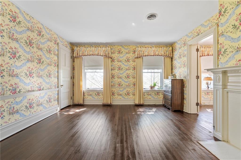 9 Little Sewickley Creek Road Sewickley, PA 15143 - Photo 23 of 34 a view of a big room with wooden floor and windows with curtains