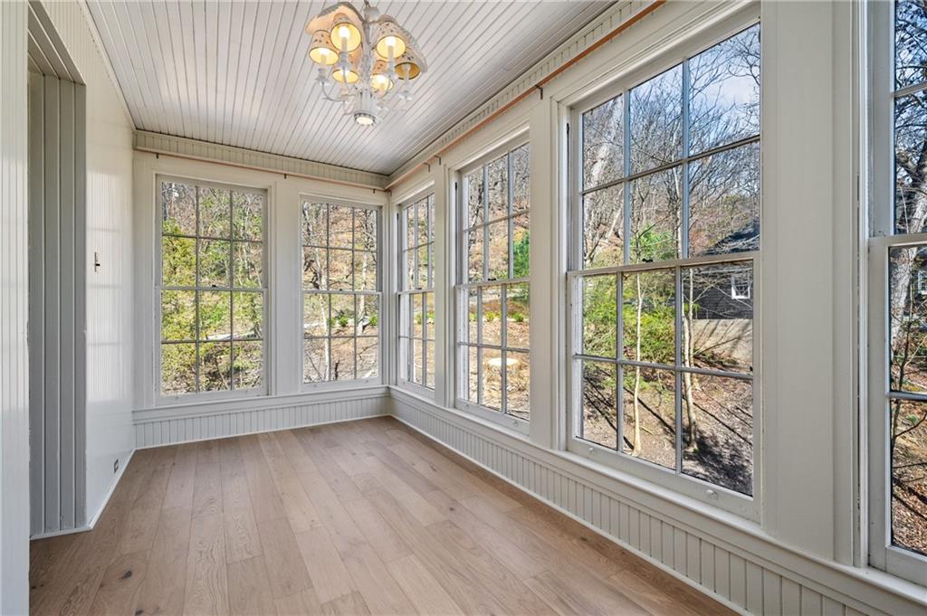 9 Little Sewickley Creek Road Sewickley, PA 15143 - Photo 24 of 34 a view of an empty room with wooden floor and a window