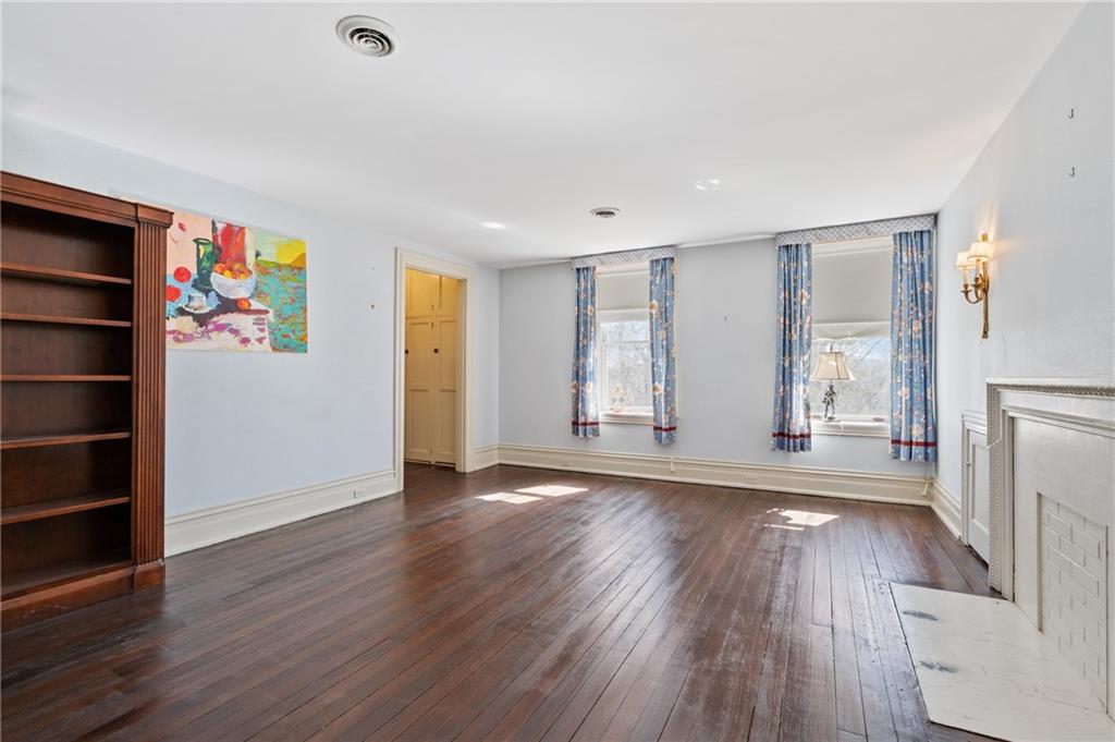 9 Little Sewickley Creek Road Sewickley, PA 15143 - Photo 27 of 34 an empty room with wooden floor and windows