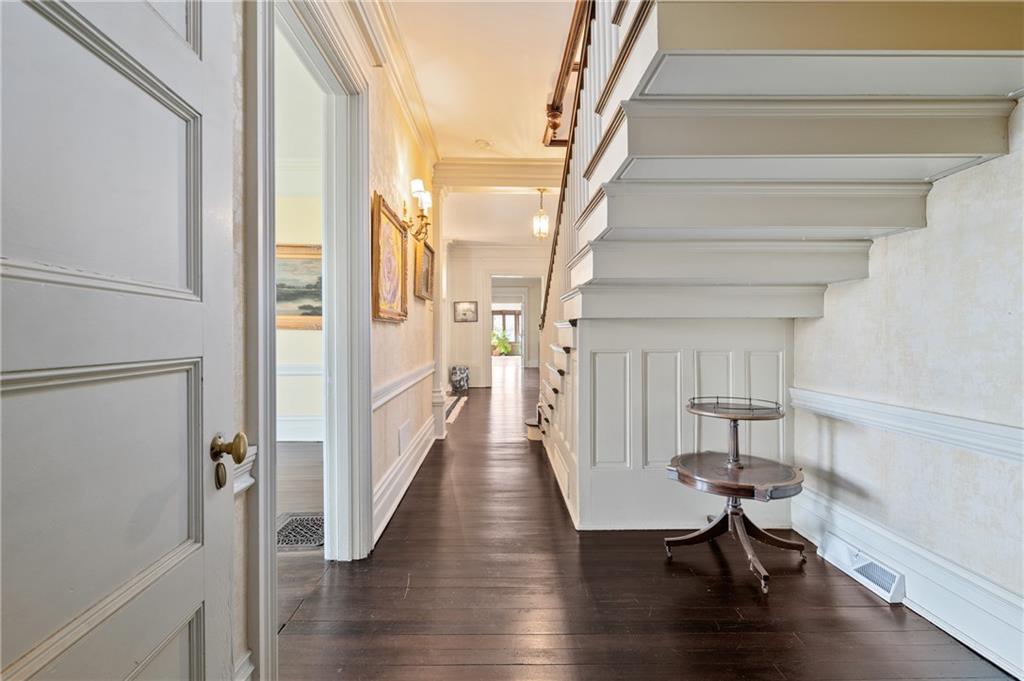 9 Little Sewickley Creek Road Sewickley, PA 15143 - Photo 7 of 34 a view of a hallway with wooden floor table and chairs