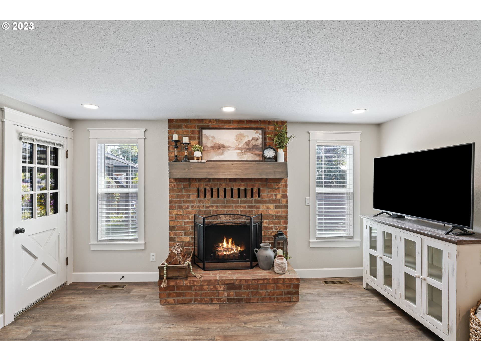 349 72nd Place Springfield, OR 97478 - Photo 18 of 42 a living room with furniture and a flat screen tv
