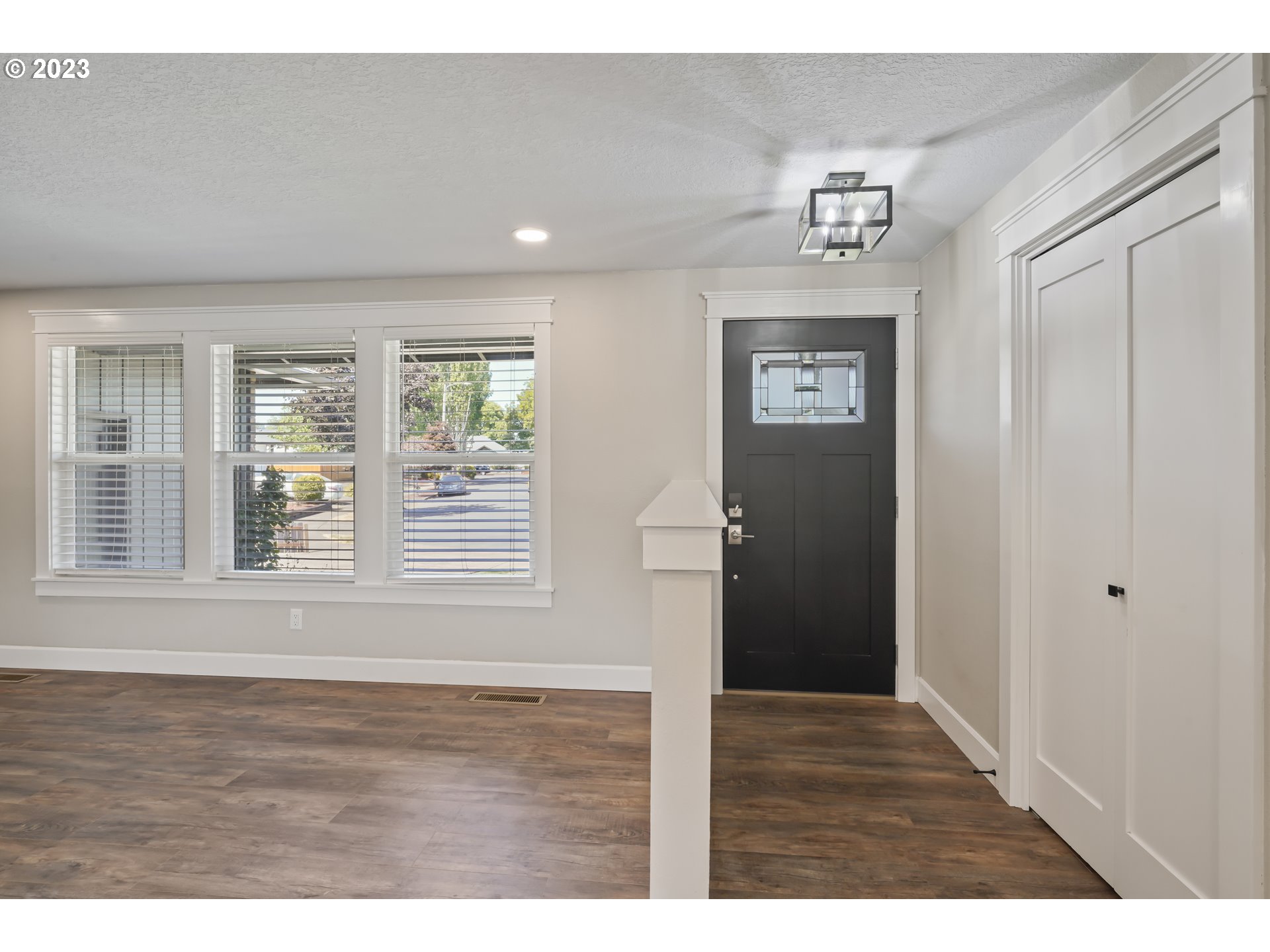 349 72nd Place Springfield, OR 97478 - Photo 5 of 42 a view of an empty room with wooden floor and a window