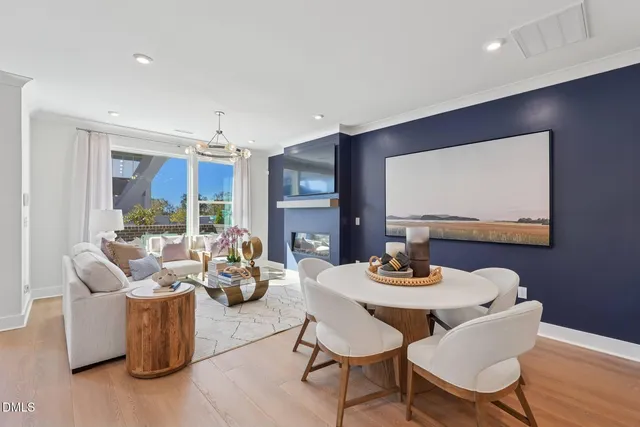 a dining room with furniture and wooden floor