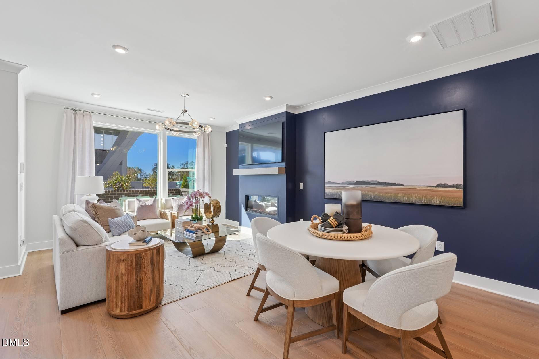 a dining room with furniture and wooden floor