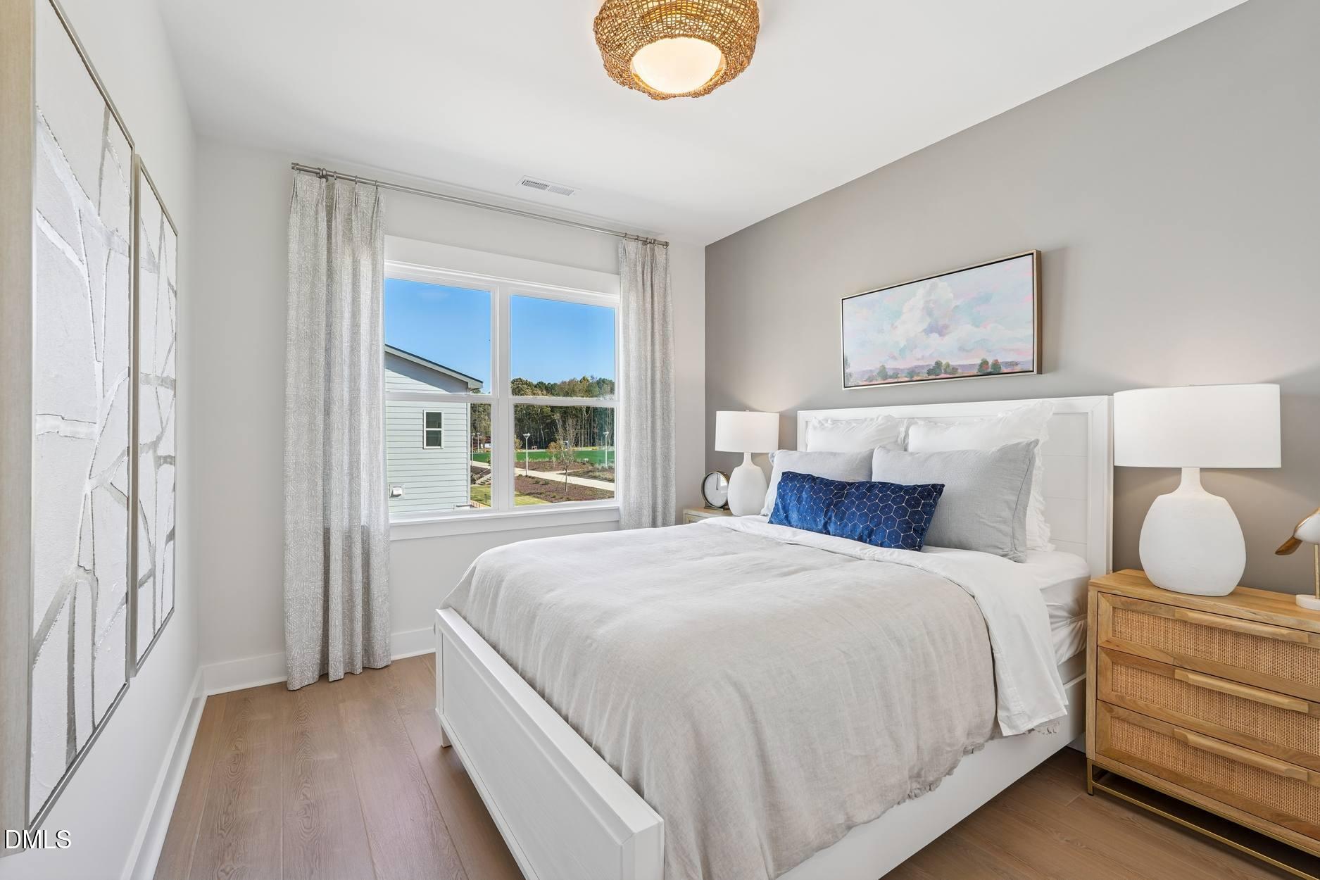 72 Wandering Way Pittsboro, NC 27312 - Photo 12 of 20 a bedroom with a bed and a window
