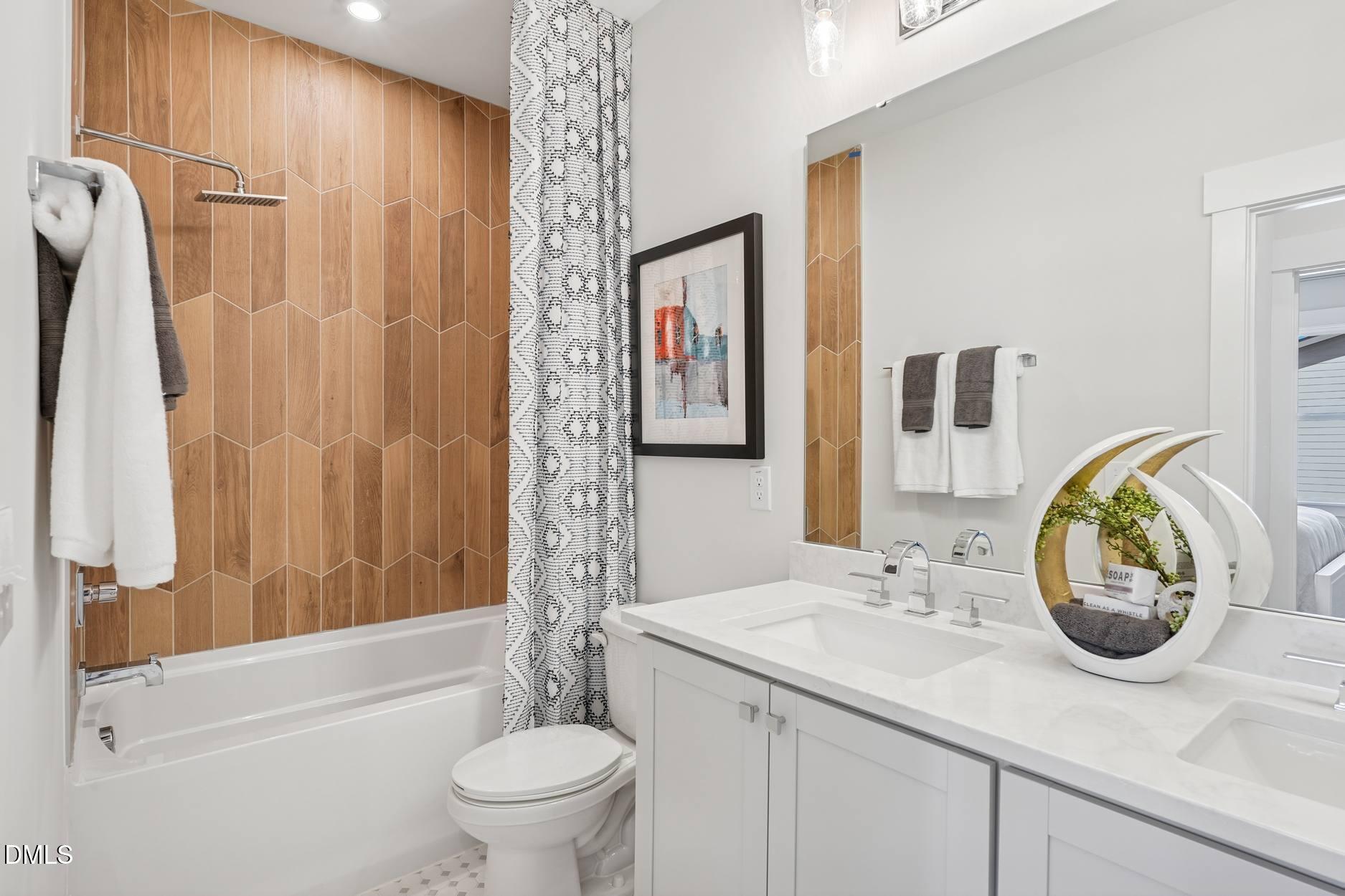 72 Wandering Way Pittsboro, NC 27312 - Photo 13 of 20 a bathroom with a sink a toilet and shower curtain