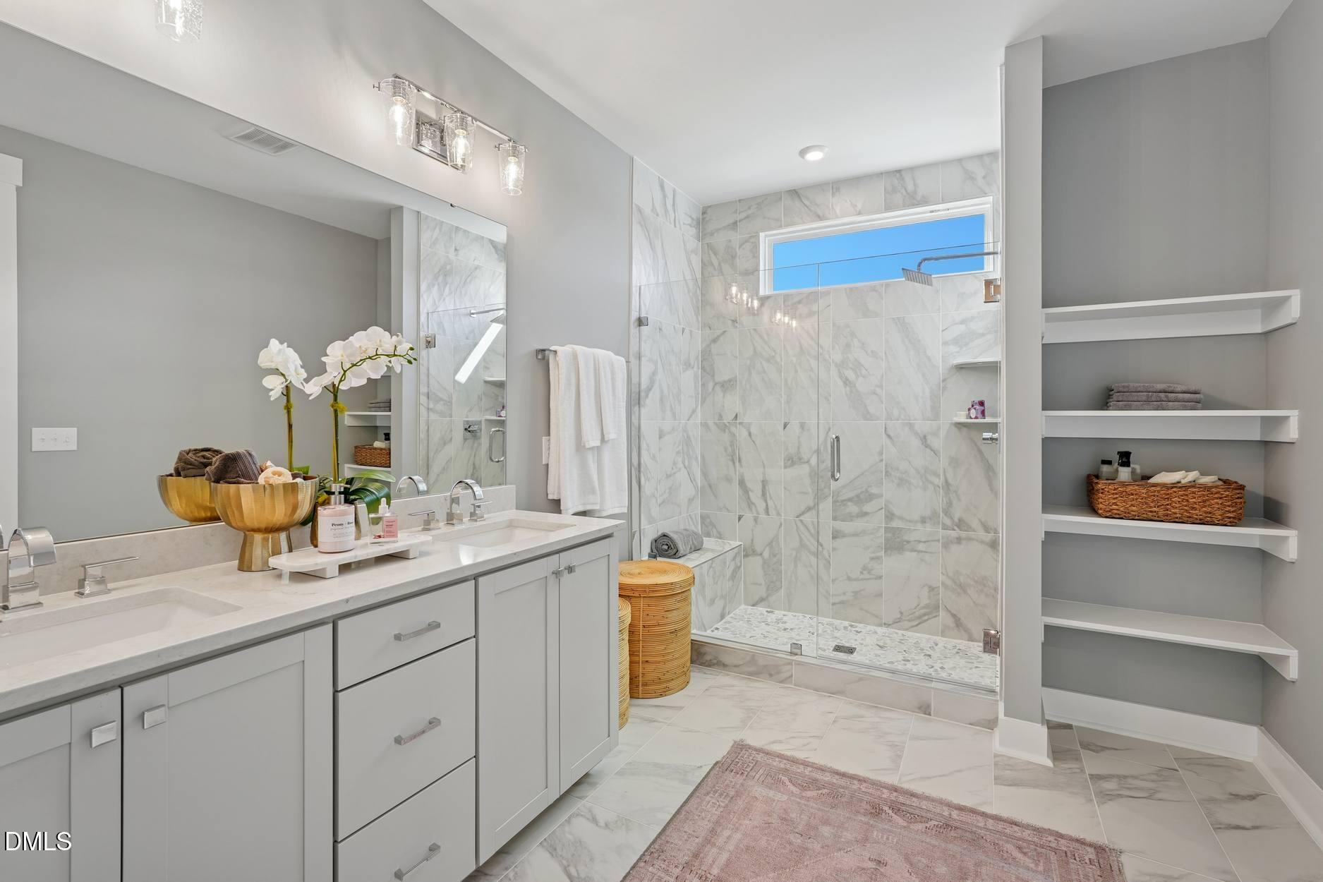 72 Wandering Way Pittsboro, NC 27312 - Photo 17 of 20 a bathroom with a double vanity sink toilet and shower