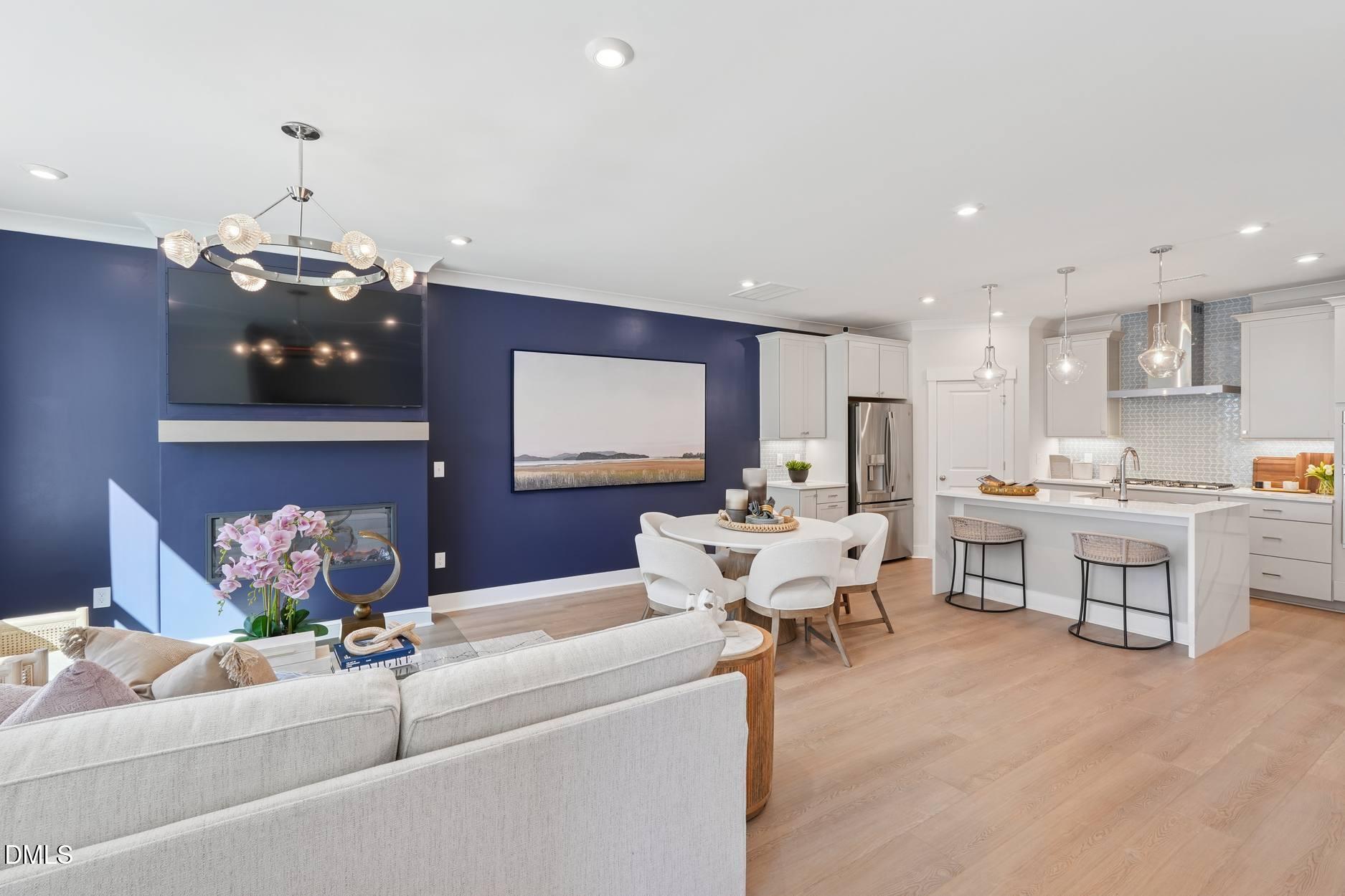 72 Wandering Way Pittsboro, NC 27312 - Photo 3 of 20 a living room with fireplace furniture and a chandelier