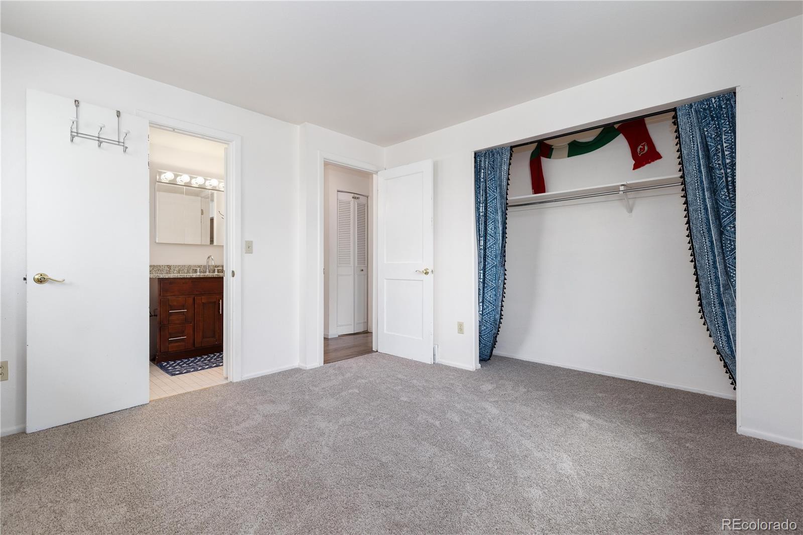 4374 East Peakview Circle Centennial, CO 80121 - Photo 17 of 45 a view of a big room with closet and cabinet