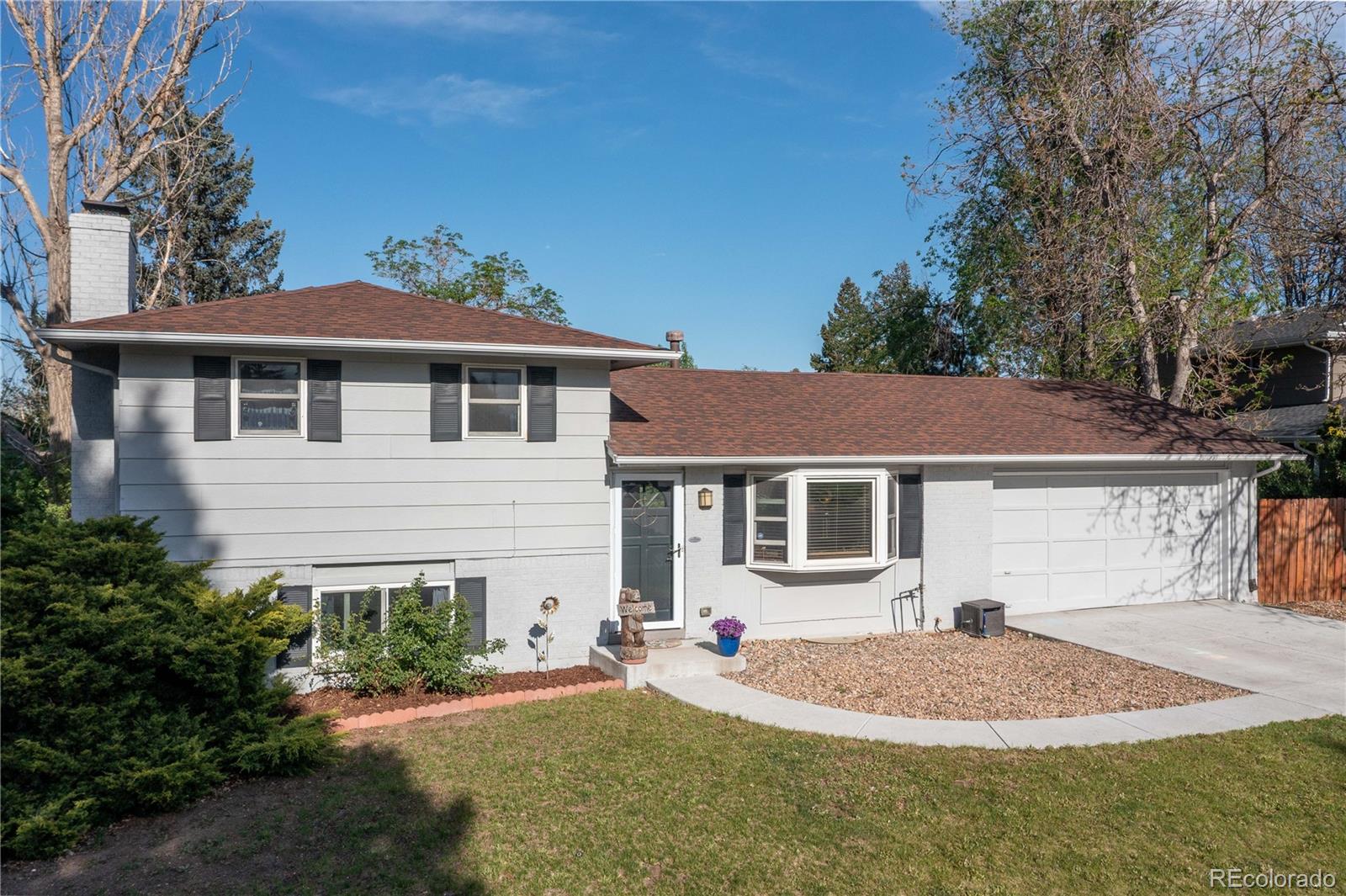 4374 East Peakview Circle Centennial, CO 80121 - Photo 2 of 45 a front view of a house with a yard