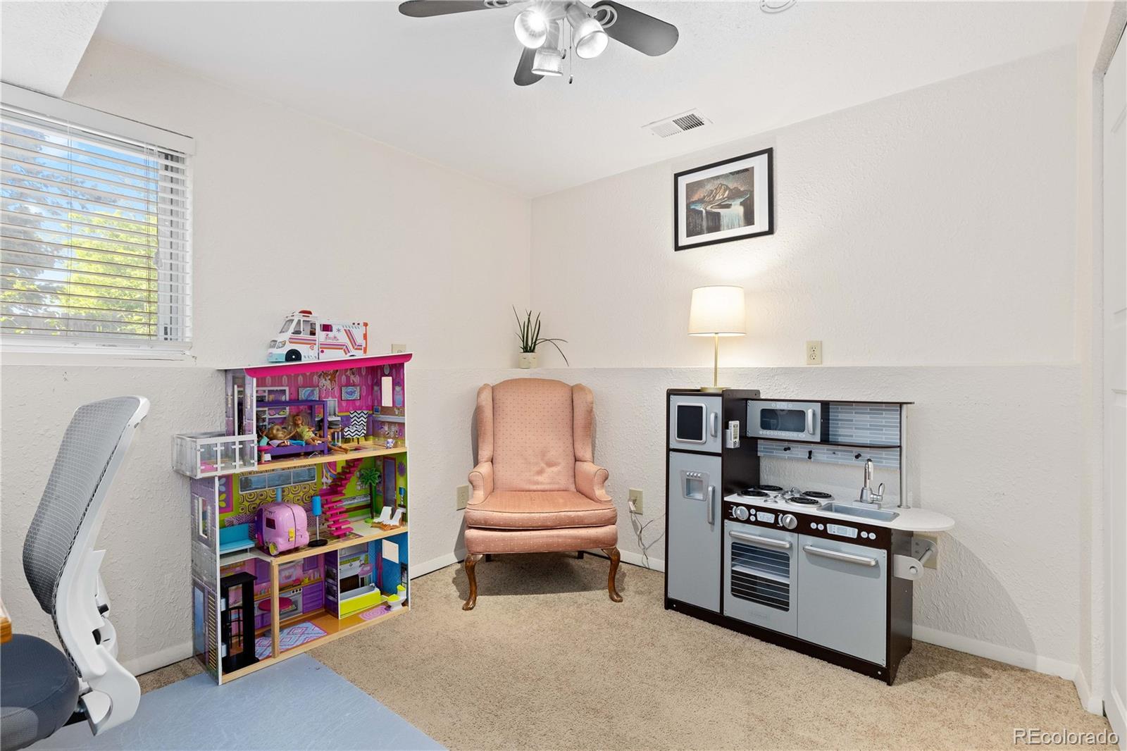 4374 East Peakview Circle Centennial, CO 80121 - Photo 23 of 45 a bedroom with furniture and a baby crib