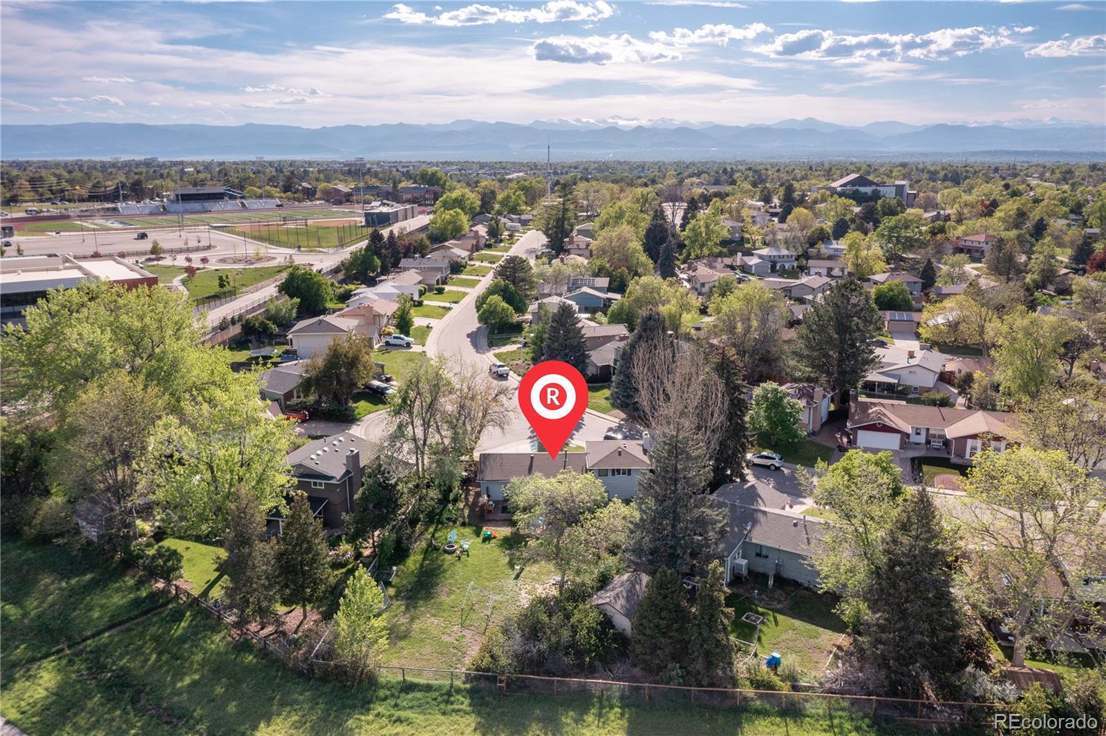 4374 East Peakview Circle Centennial, CO 80121 - Photo 40 of 45 an aerial view of residential building with parking and city view
