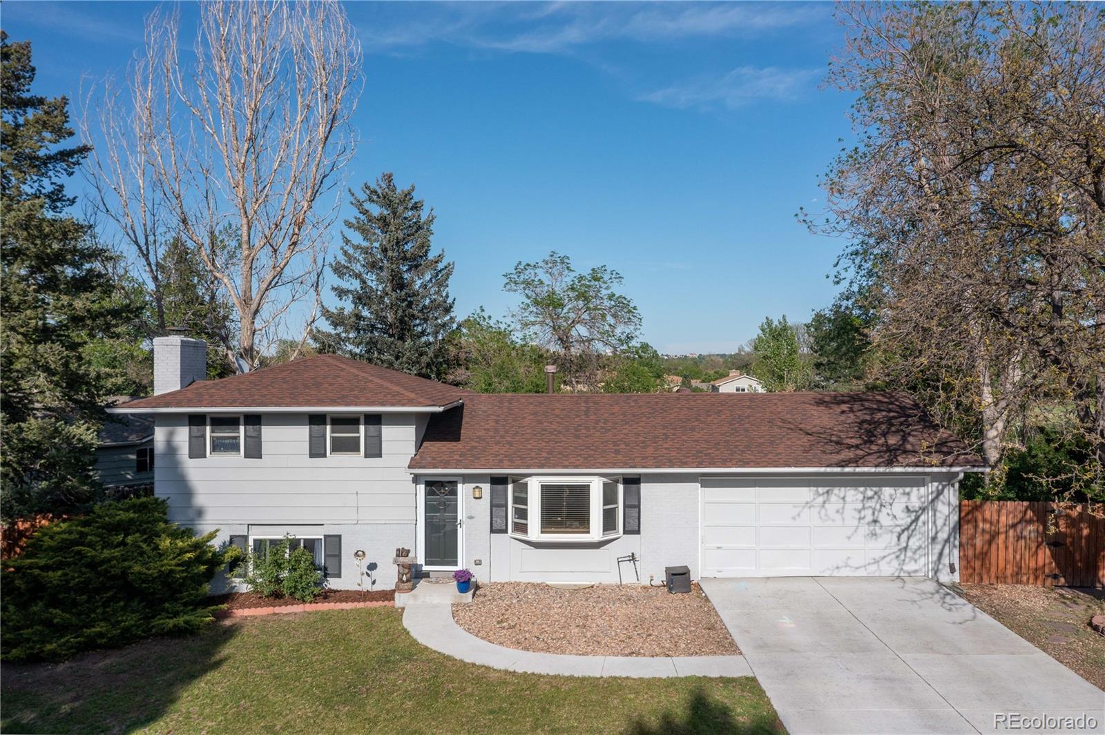 4374 East Peakview Circle Centennial, CO 80121 - Photo 5 of 45 front view of a house with yard