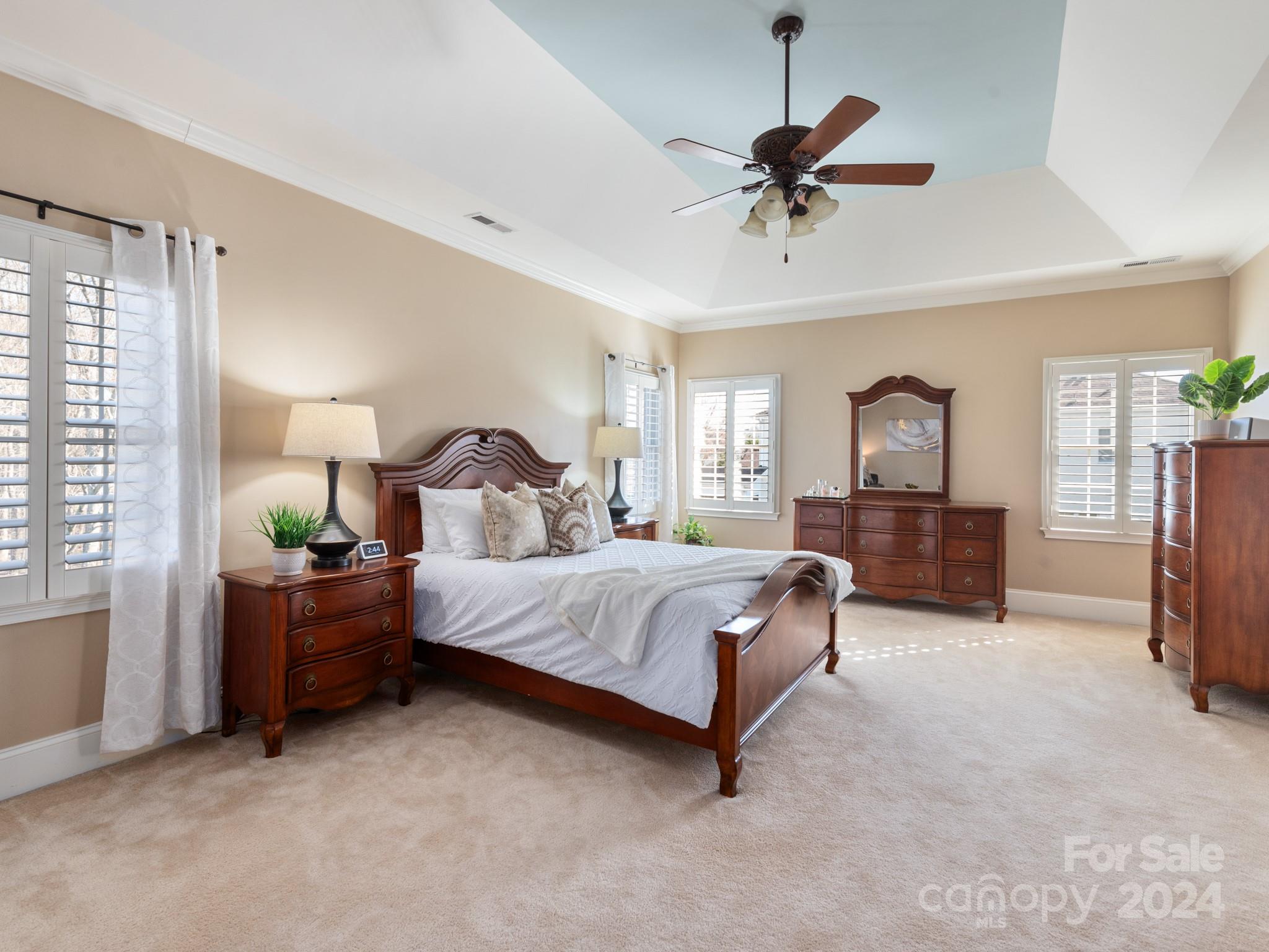 2008 Wheat Field Drive Marvin, NC 28173 - Photo 29 of 48 a bedroom with a bed and a chandelier