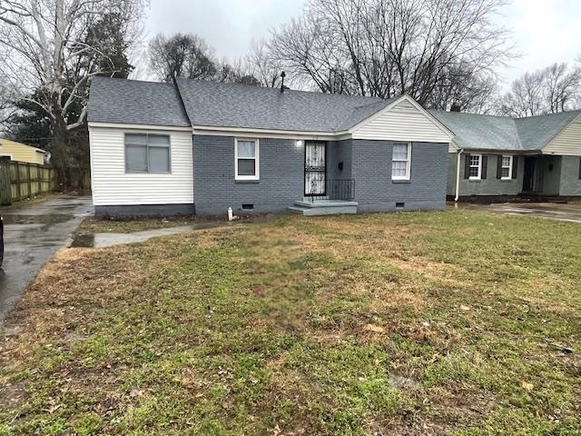 View of front of home featuring crawl space, brick siding, driveway, and a shingled roof